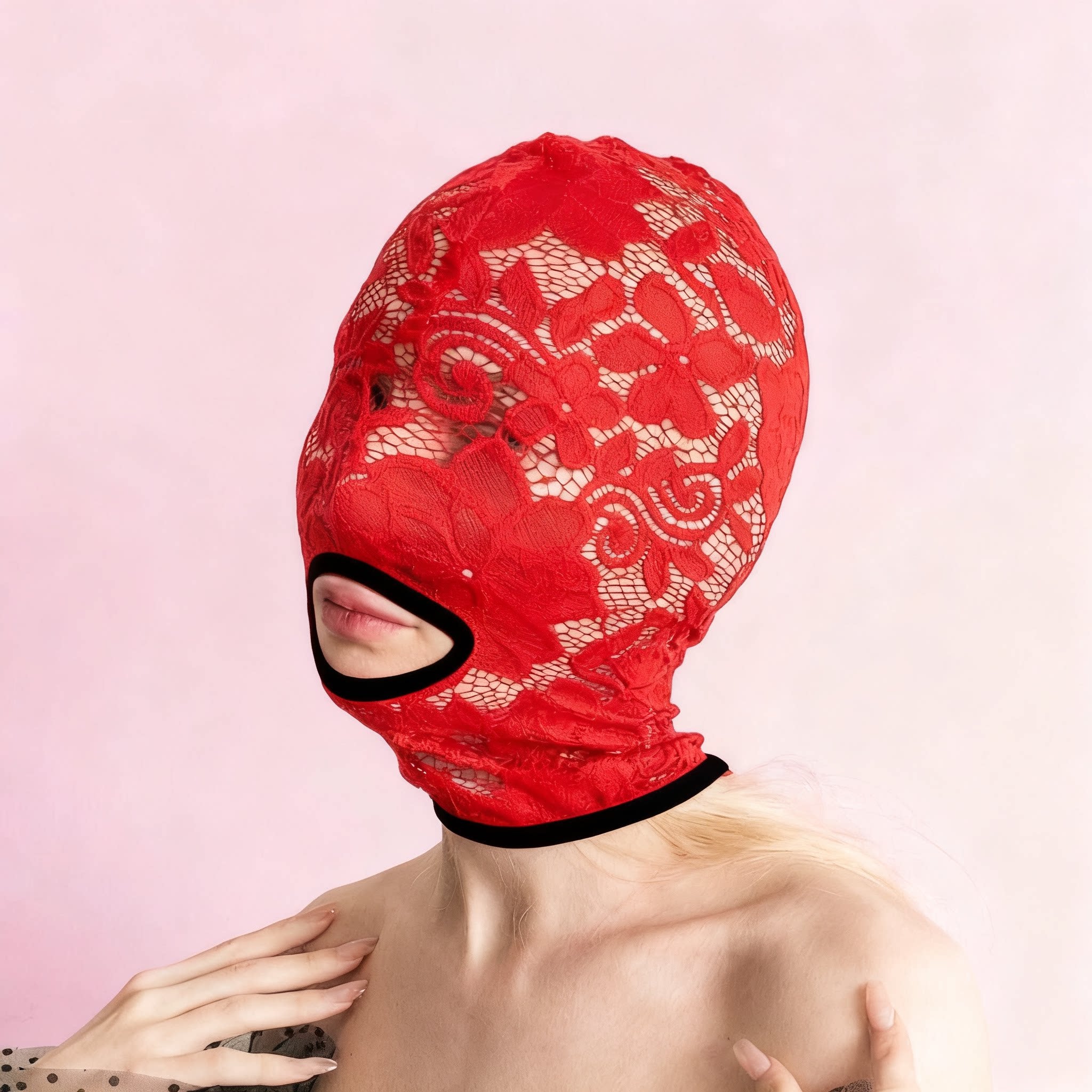 A handmade black full-face mask, only the mouth is visible. 67