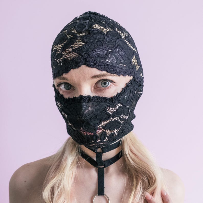 A handmade black mask that only reveals the eyes.74