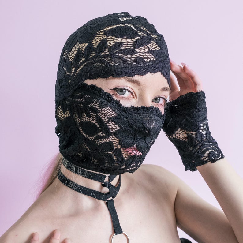 A handmade black mask that only reveals the eyes.74