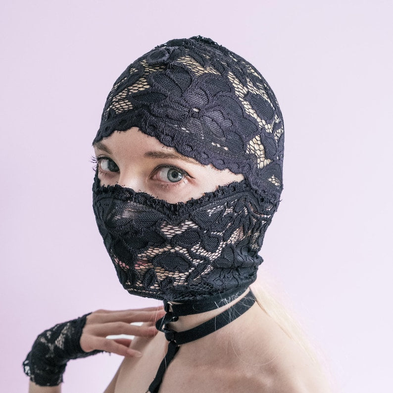 A handmade black mask that only reveals the eyes.74