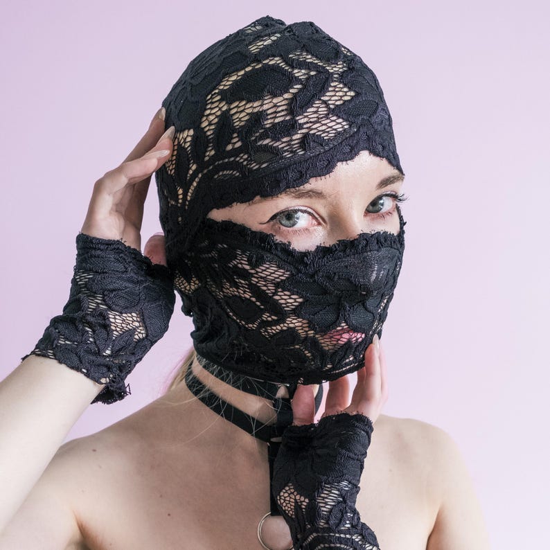 A handmade black mask that only reveals the eyes.74