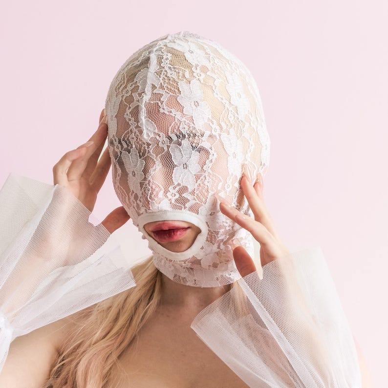 Handmade white full-face mask with only the mouth showing 70