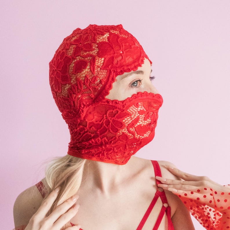 A handmade red mask, only revealing the eyes.75