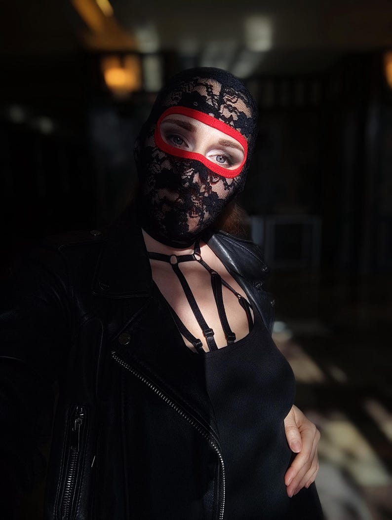 Handmade black and red lace mask, only revealing the eyes.78